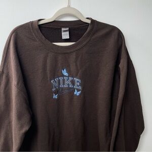 Nike butterfly embroidery crewneck made by a small shop on Etsy (not Nike)